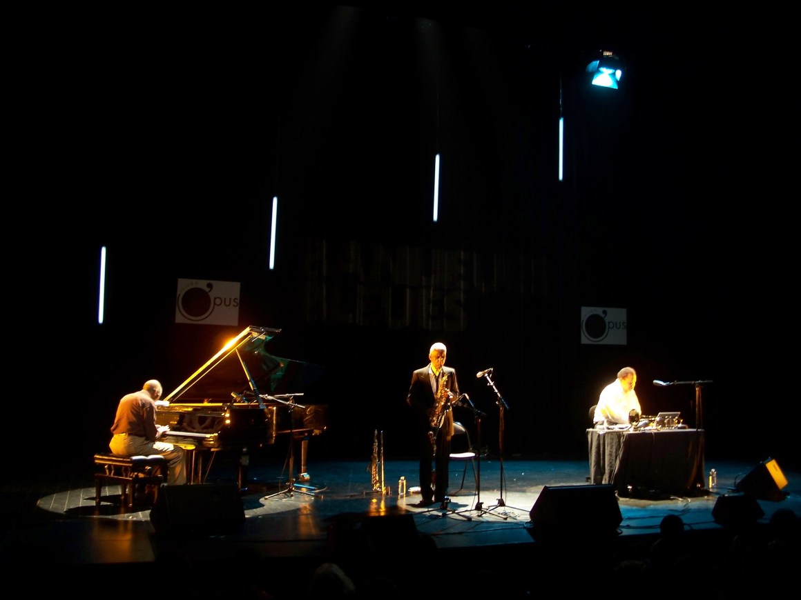 The Trio of Muhal Richard Abrams, George Lewis, and Roscoe Mitchell, on stage.