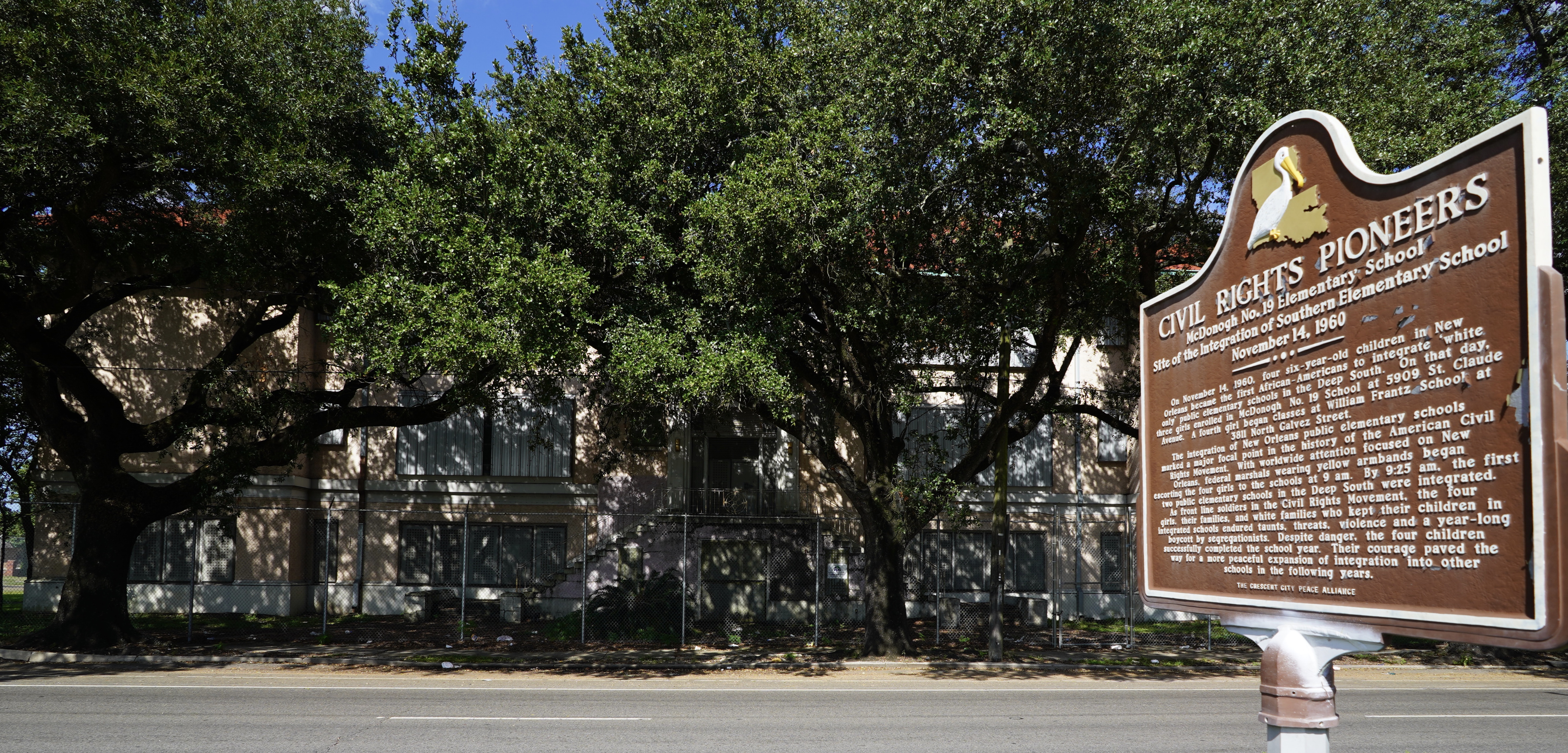 A placard outside the McDonogh 19 Elementary School describes the role of the McDonogh Three in school desegregation.