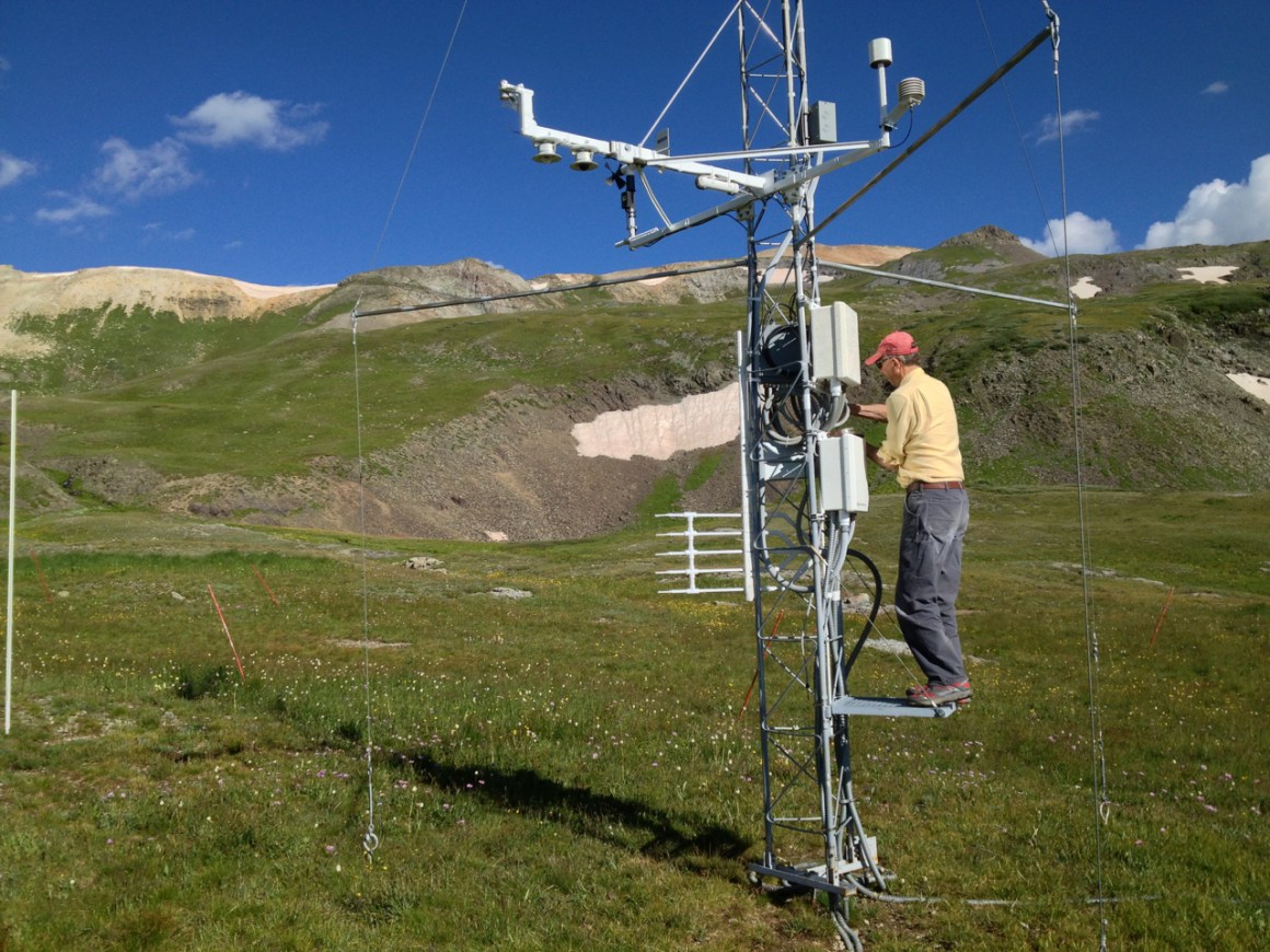 Mountain researcher Chris Landry, former director of the Colorado Center for Snow and Avalanche Studies, checks climate measuring instruments at a research station at 11,000 feet elevation in the San Juan Mountains of Colorado.