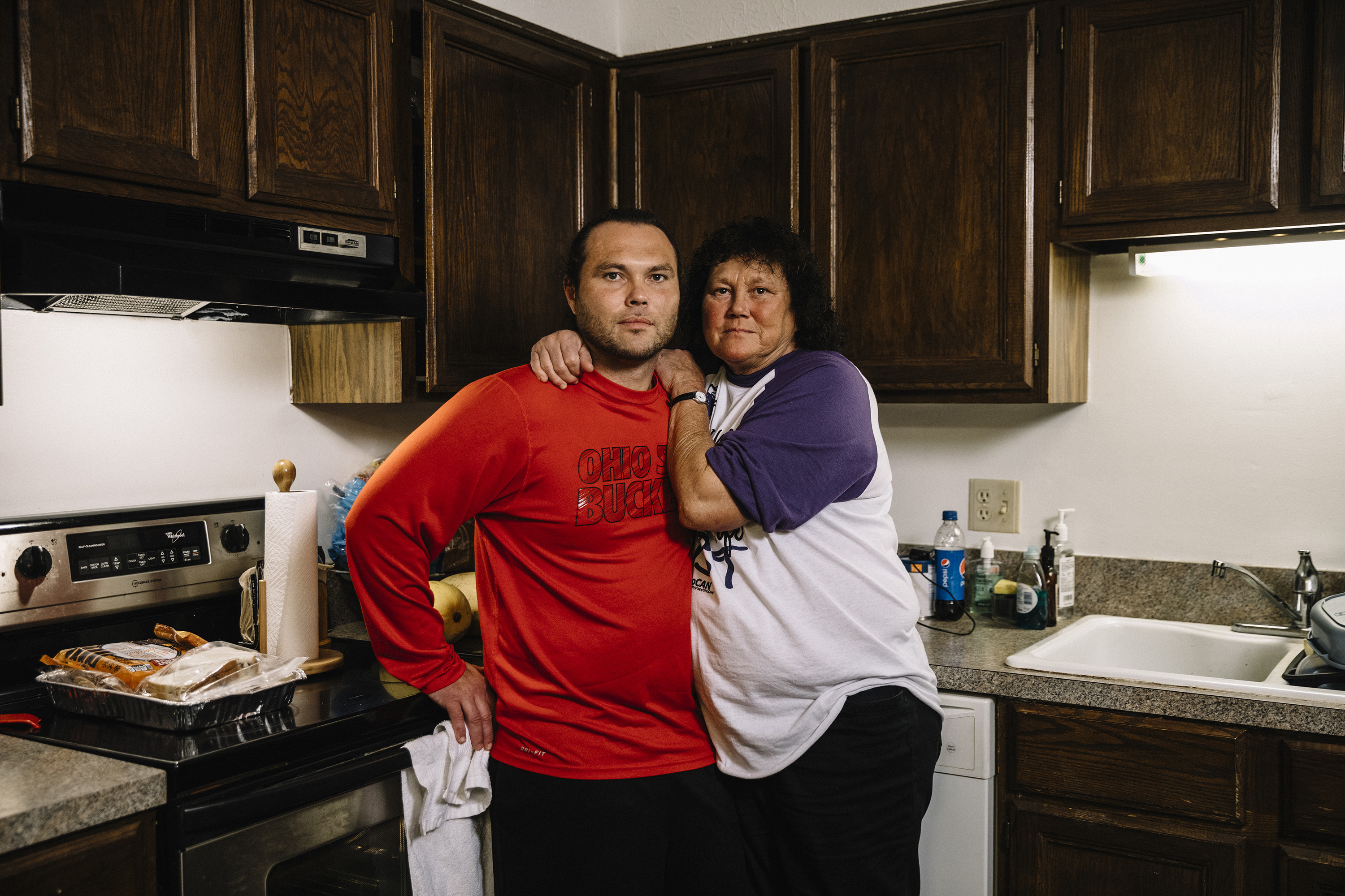 Newark, Ohio, September 8th. 2018: Billy McCall and his mother, Patricia Perry, stand in the kitchen of Patricia's apartment in downtown Newark.