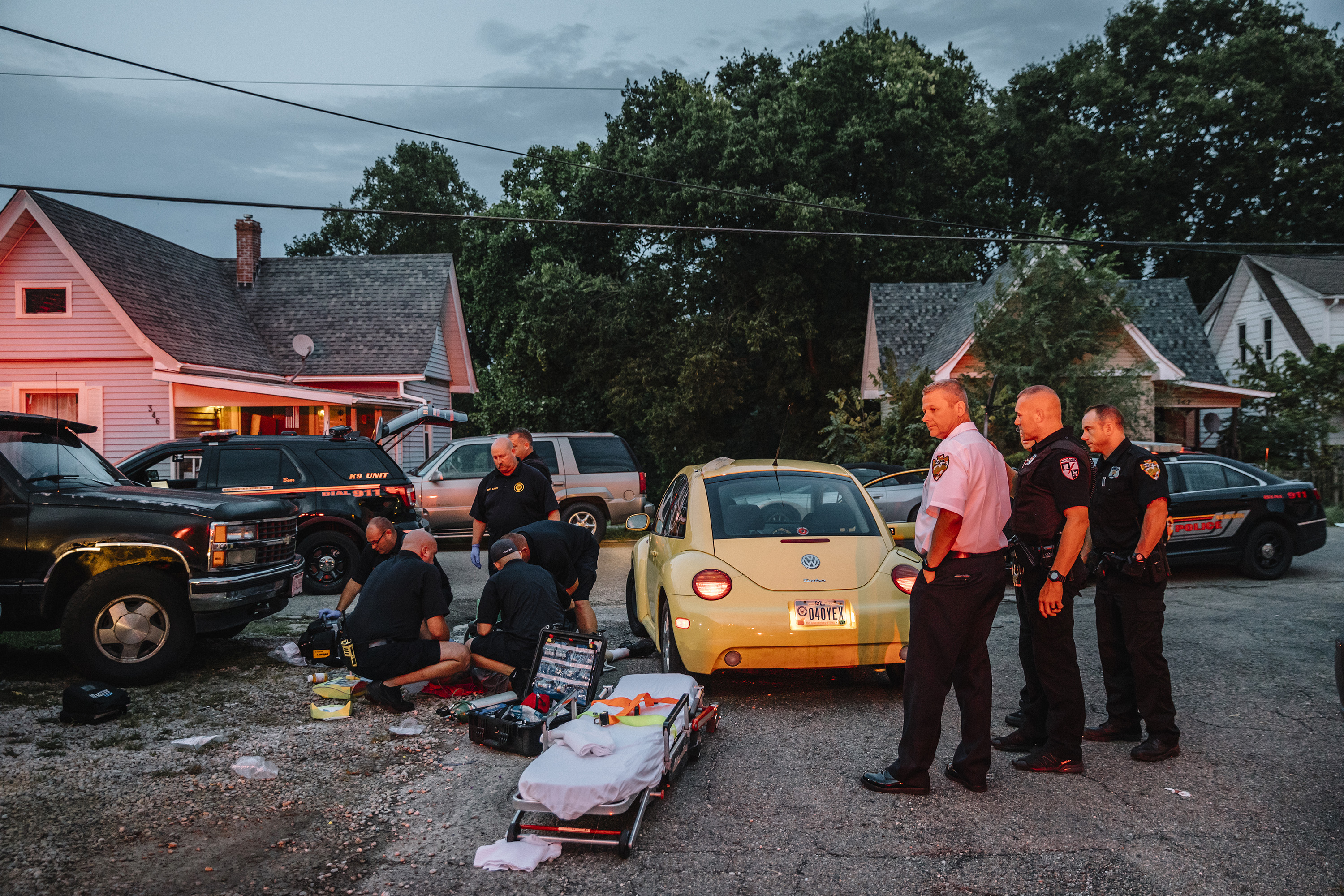 Newark, Ohio, September 6th, 2018: Flashing lights from emergency vehicles light up a residence on Elmwood Avenue in downtown Newark. Emergency responders administered naloxone to a 62-year-old man and hooked him up to an automated CPR machine before loading him into the ambulance and rushing to the emergency room.