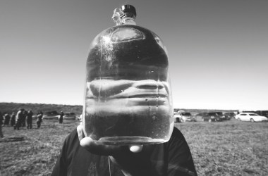 A jug of purified water, reinforcing the ongoing role of the Water Protectors.