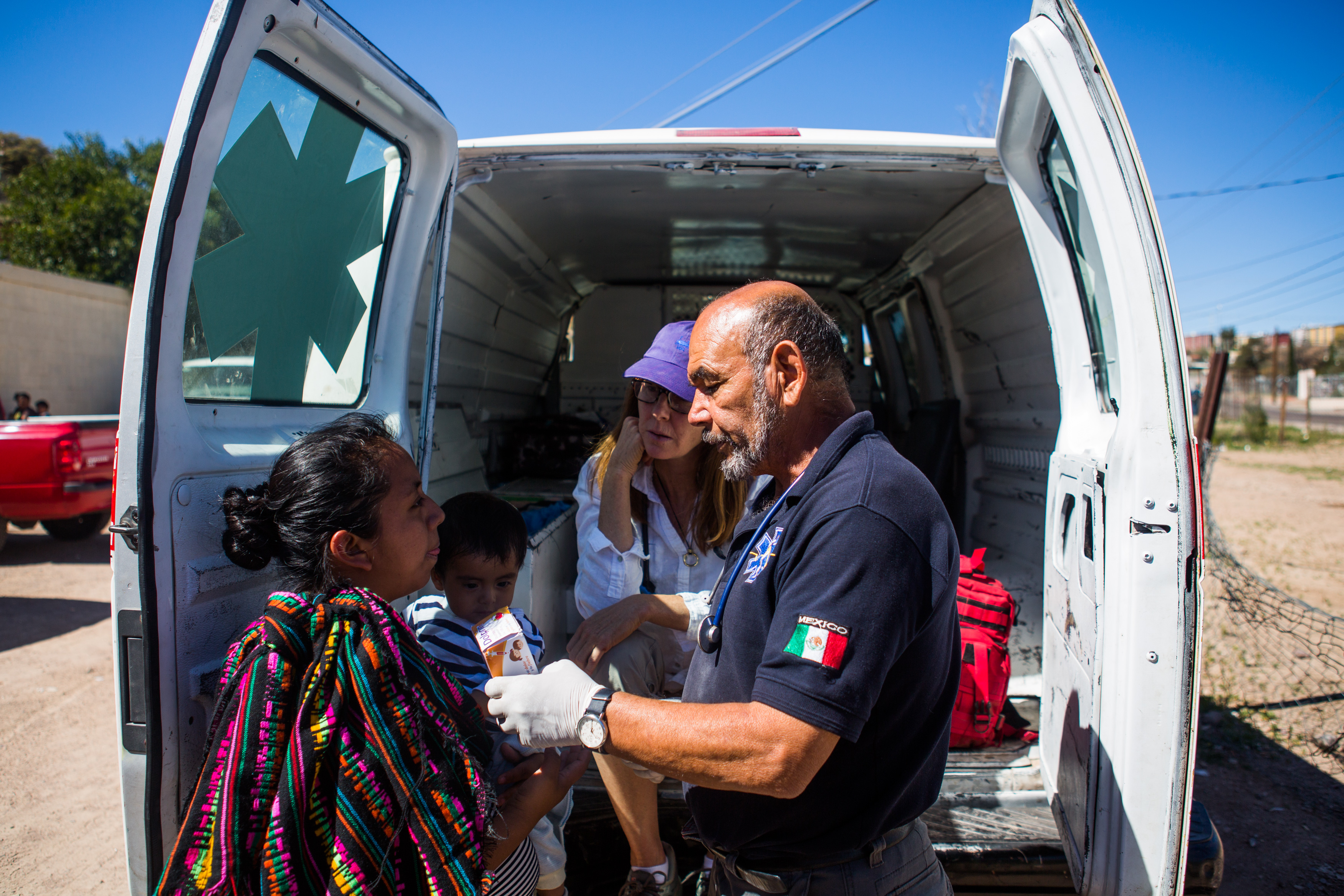 Panchito tends to an infant in Nogales, Mexico. After being booked on a DUI in 2008, he was deported from Phoenix, Arizona, where he had lived for 30 years and raised three daughters. Unwilling to risk the illegal desert crossing, he decided to make a life on the other side of the border, helping refugees and migrants seeking asylum.