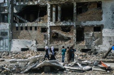 Locals gather near the site of a complex attack that killed at least 20 people and injured 50 more in Kabul, Afghanistan, on July 28th, 2019. The target of the attack was the campaign headquarters of President Ashraf Ghani's vice presidential running mate, Amrullah Saleh.