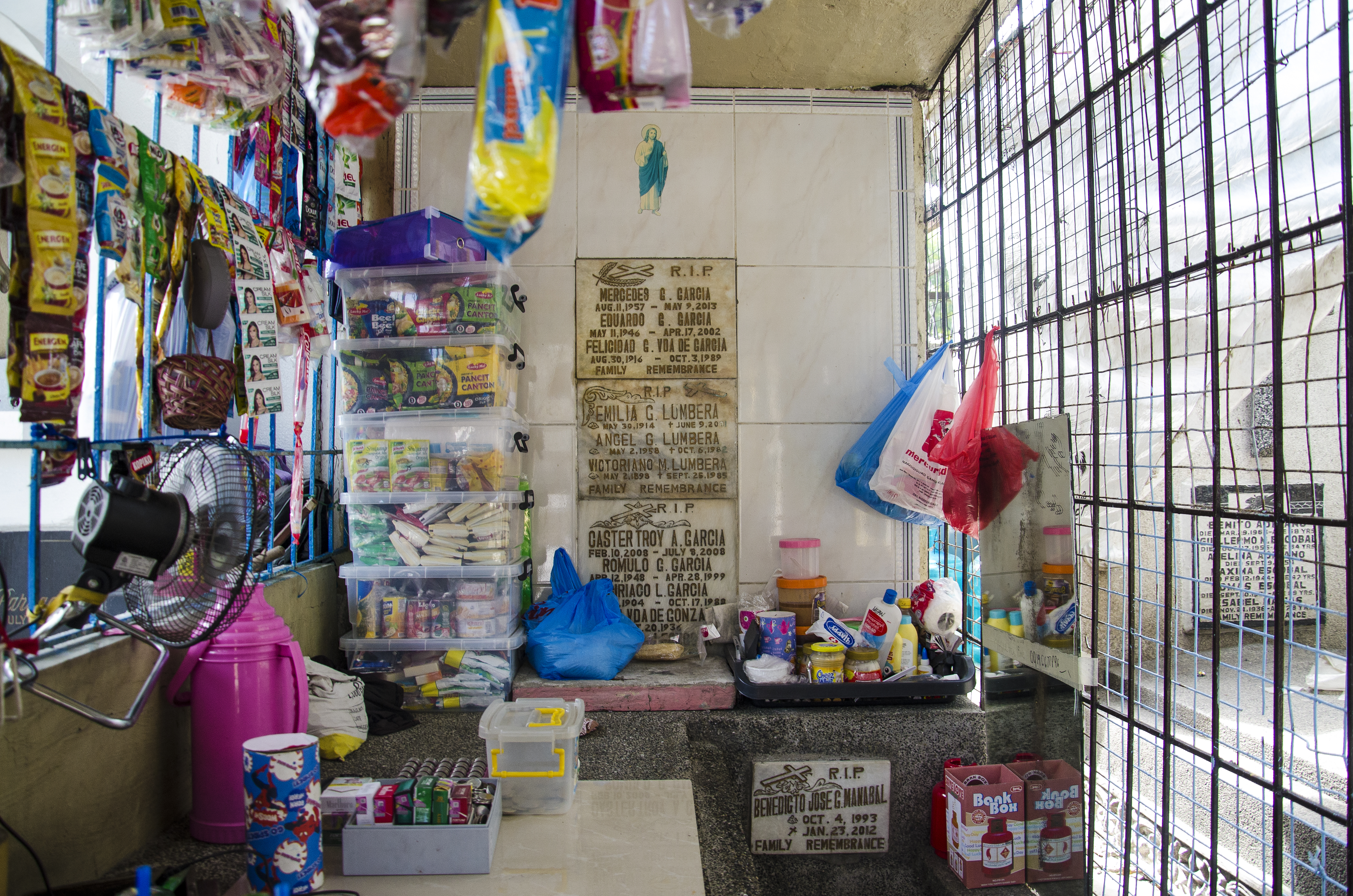 Some of the community inside Manila North Cemetery have found work through makeshift stores, others are gravediggers. Many are living in the graves illegally and are not working.