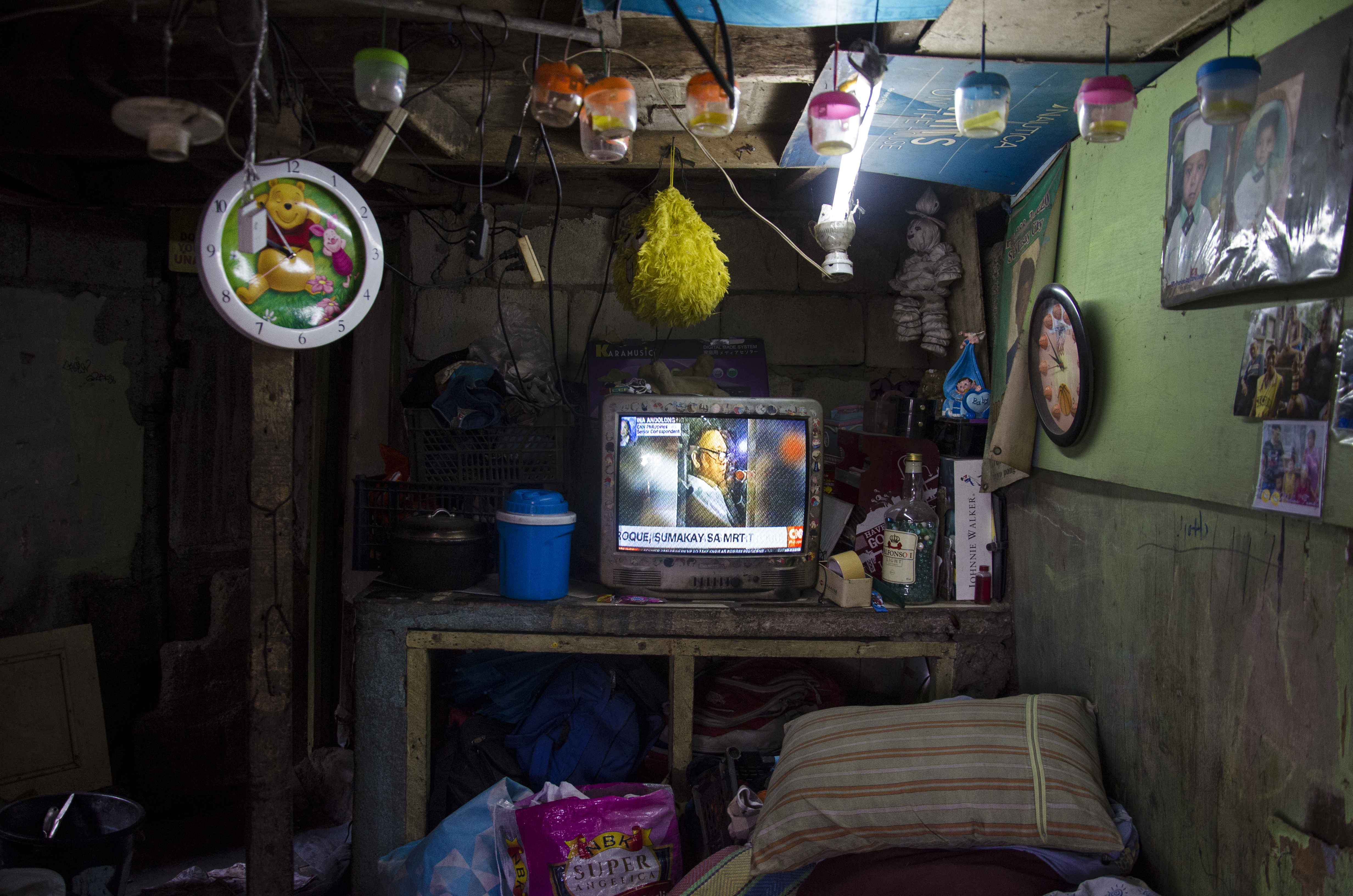 Ricardo Medina, a caretaker in Pasay cemetery, found out his 24-year-old son, Ericardo, had been killed in an EJK after seeing him on the television with his head wrapped in packaging tape and a sign tied across his chest that read 