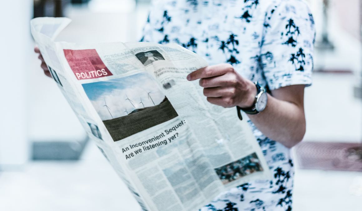 man reading newspaper