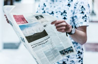 man reading newspaper