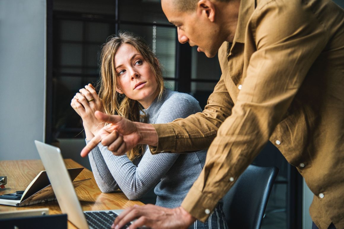 Woman and man in a workplace.