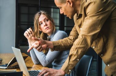 Woman and man in a workplace.