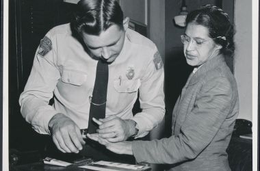 Rosa Parks being fingerprinted by Deputy Sheriff D.H. Lackey after being arrested for boycotting public transportation in Montgomery, Alabama, in February of 1956.