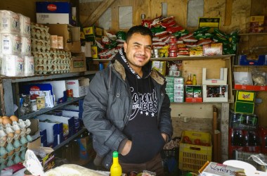 Sammy Hambod presiding over his grocery store in the Skaramagas camp outside Athens.