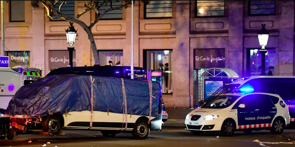 The van that ploughed into a crowd, killing at least 13 people and injuring around 100 others is towed away from the Rambla in Barcelona on August 18th, 2017. Officers in Spain's second-largest city said the ramming on Las Ramblas was a 