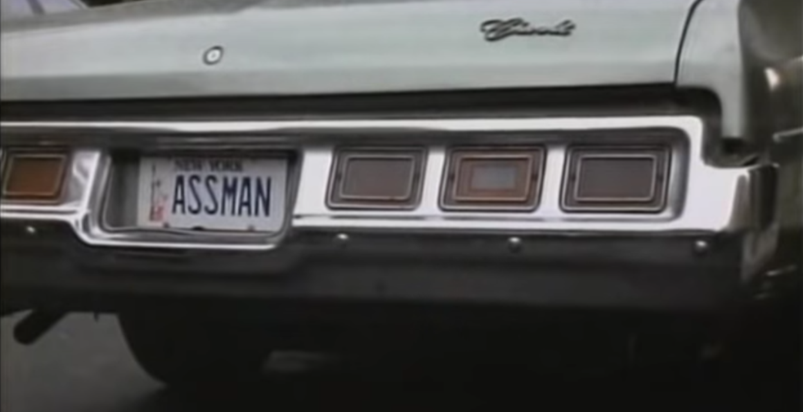 A vanity license plate reading "ASSMAN"