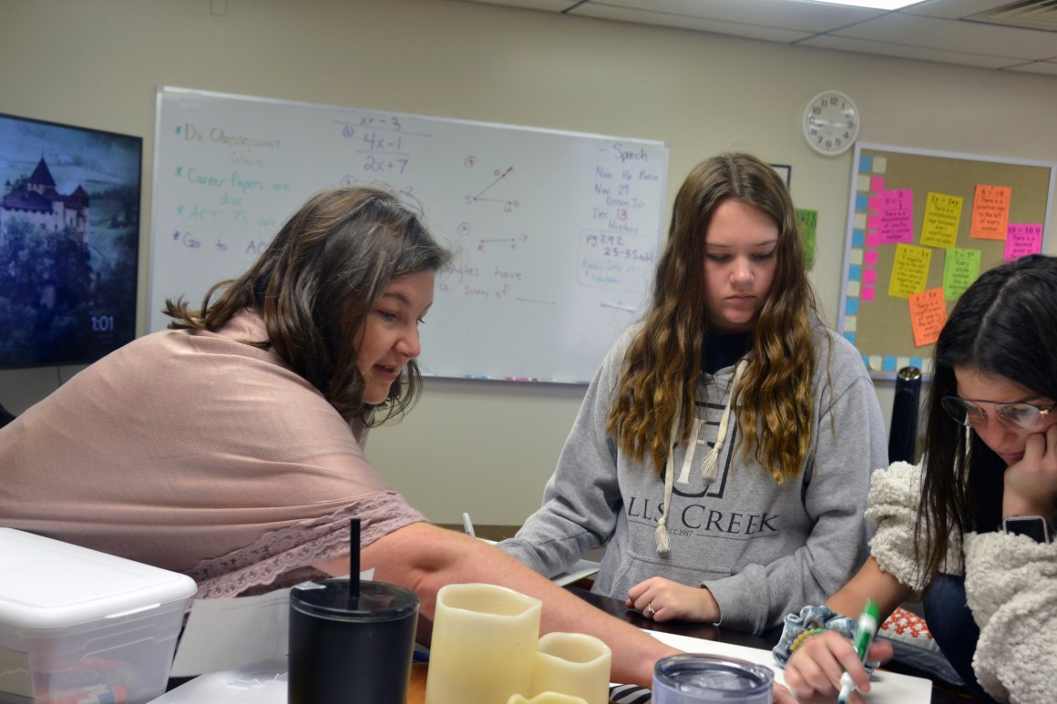 Math teacher Charity Hobbs helps her students prepare for the ACT test. Hobbs taught in a small school in Shawnee, Oklahoma, before joining the Academy of Seminole charter school when it opened this fall.