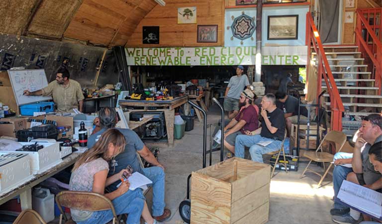 A solar technology training class gathered on Energy Independence Day weekend, July 4th, 2017, at Red Cloud's factory on the Pine Ridge Reservation.