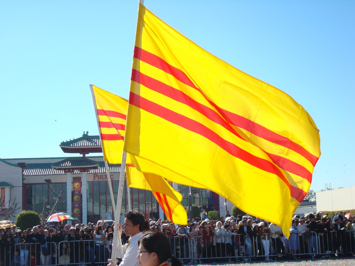 Vietnamese Americans marching with the South Vietnamese flag during the Vietnamese New Year.