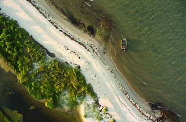 Waves lap the north coast of Tangier Island, an area known as Uppards that was inhabited until 1929. Grave markers of the local population's ancestors are regularly found on these eroded beaches.