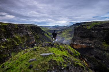 man takes a hike on a mountain