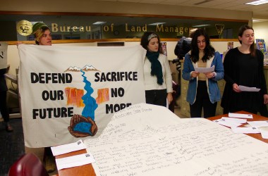 Young people protesting a Bureau of Land Management oil and gas lease sale in Salt Lake City read messages from those who oppose the sale.