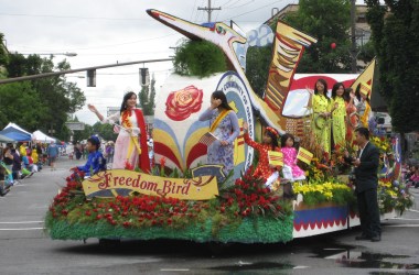 Members of the Vietnamese community celebrate on a float at the Portland Rose Festival parade.