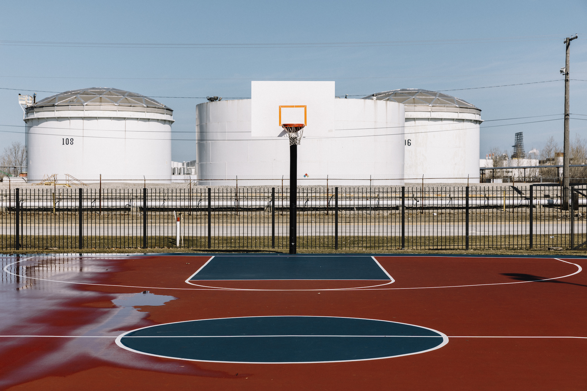 Oil storage tanks loom across the street from Tod Park in downtown East Chicago.