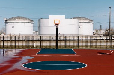 Oil storage tanks loom across the street from Tod Park in downtown East Chicago.