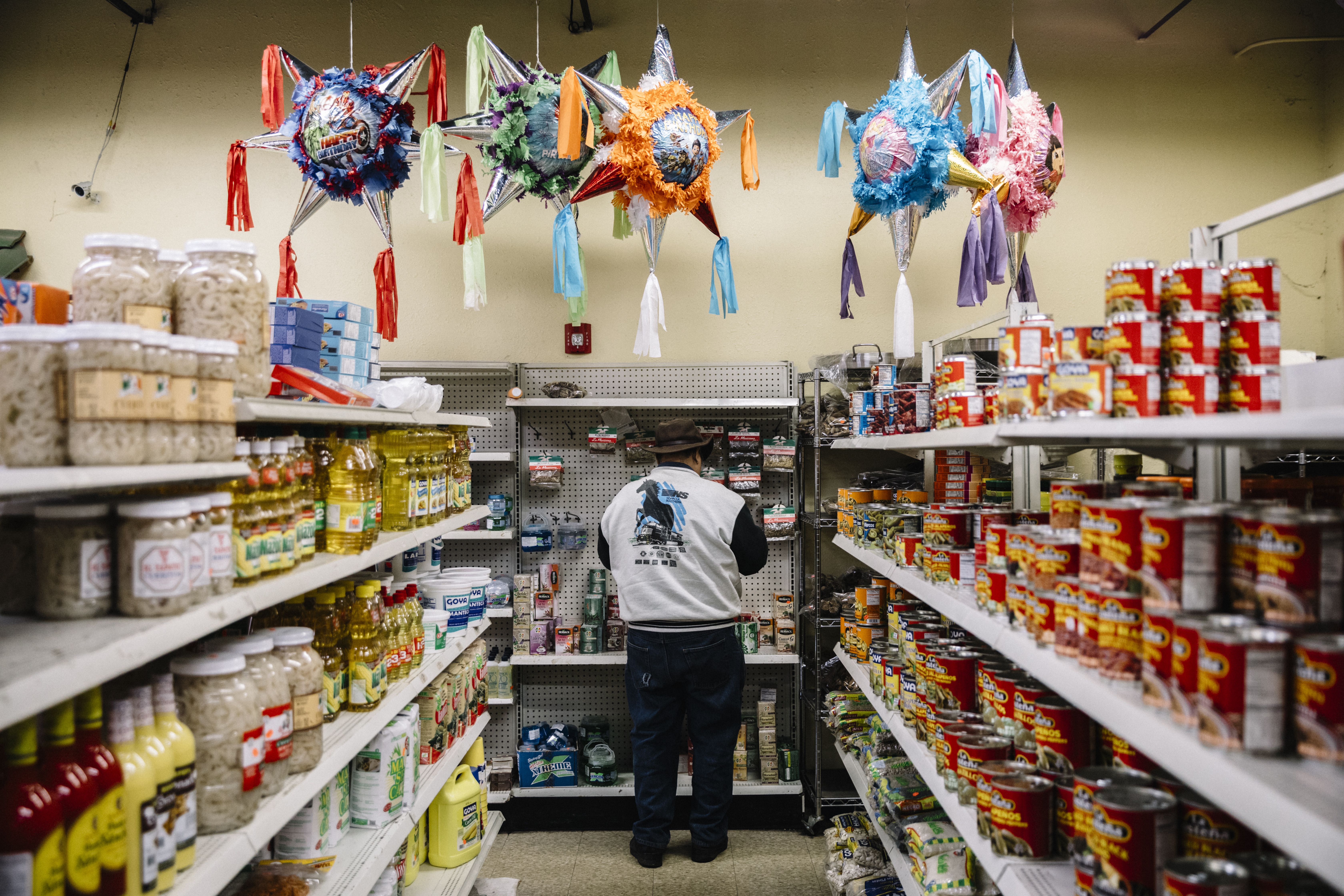 Piñatas hang from the ceiling in Tienda El Ranchito, a Latin grocery store in Fairmont City, Illinois.