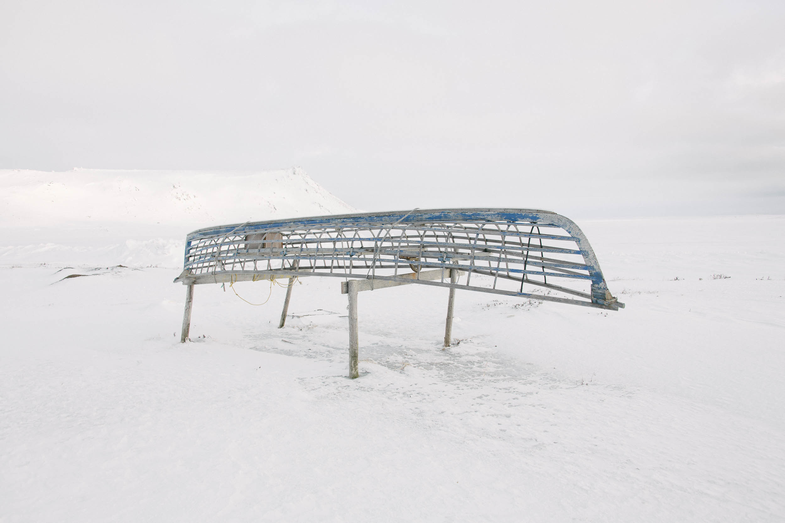 The frame of a traditional skinboat rests on trestles. The Yup'ik have hunted and fished Gambell's prolific seas for thousands of years, but some families have recently had to abandon the use of skinboats for hunting, as retreating sea ice is threatening the walrus herds and shortening the hunting season.